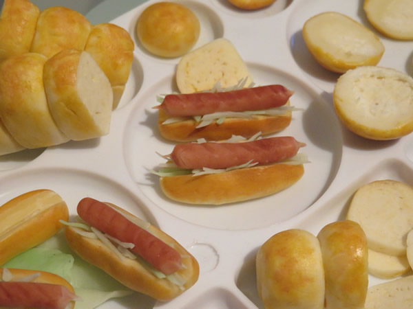 miniature loaf breads and hot dogs